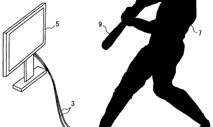 a guy swinging a baseball bat in front of a tv
